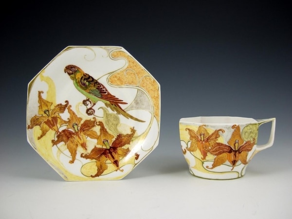 Rozenburg porcelain cup and saucer with parrot 1 600x450 - Rozenburg, Den Haag, R. Sterken, 1903