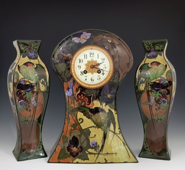 Proportio Divina | Rozenburg Den Haag earthenware clock garniture by Hartgring 1908