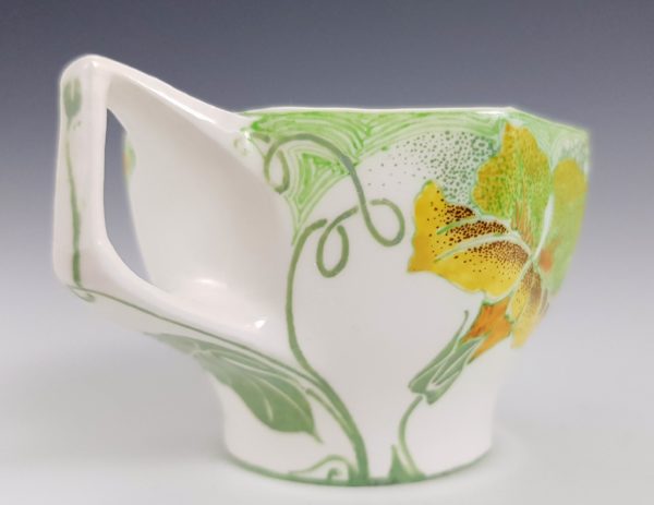 Proportio Divina | Rozenburg Den Haag porcelain cup and saucer by Sam Schellink 1904